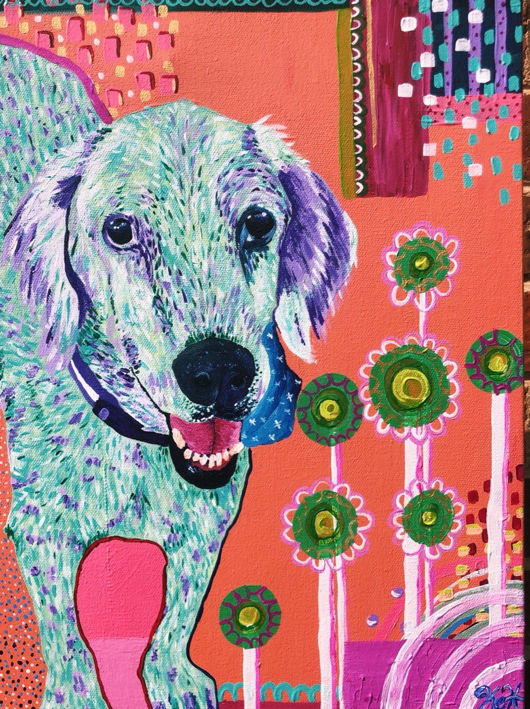 Painting of a pale green dog beside painted flowers on orange