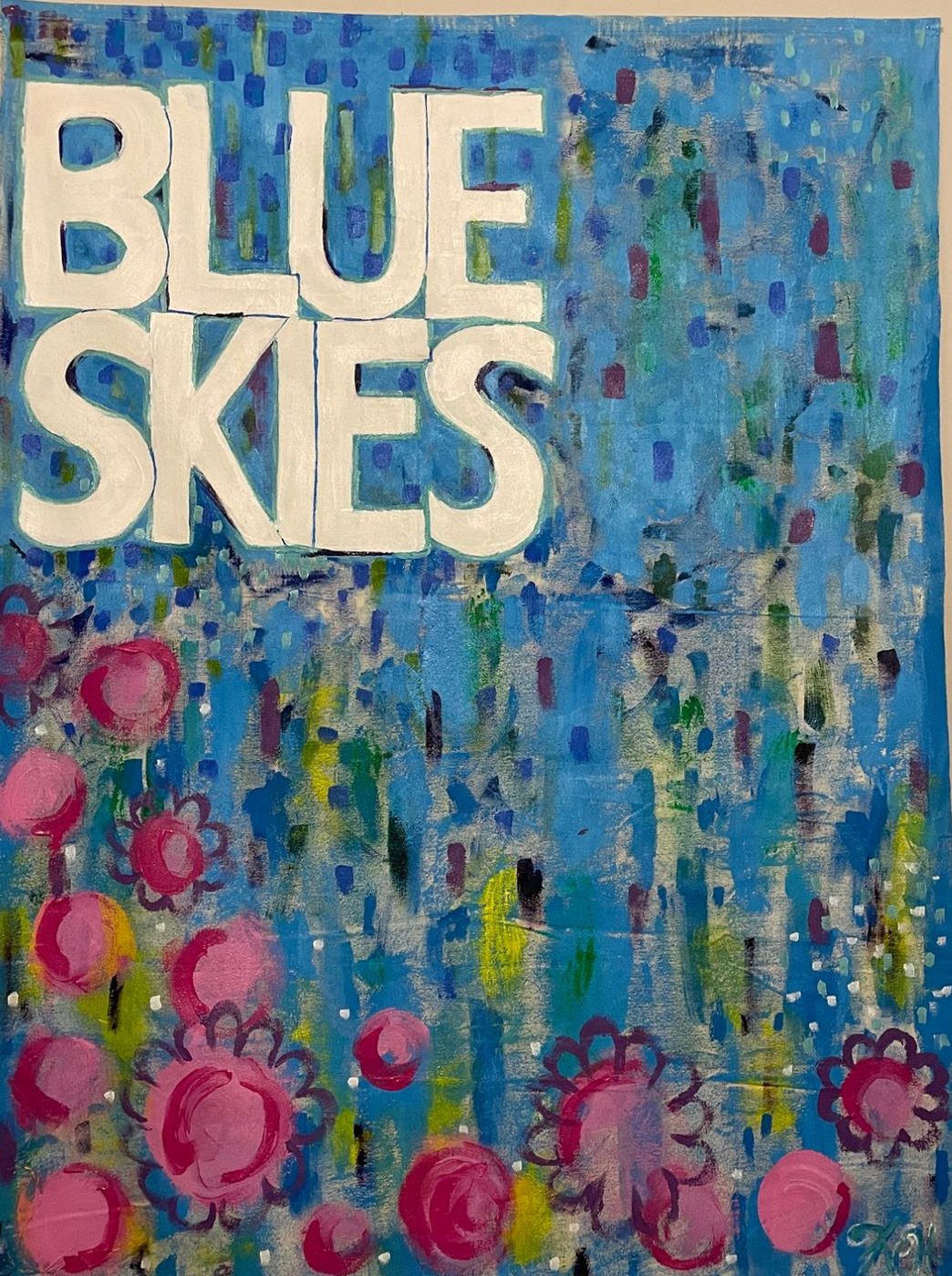 Painting with the words Blue Skies above pink flowers on blue