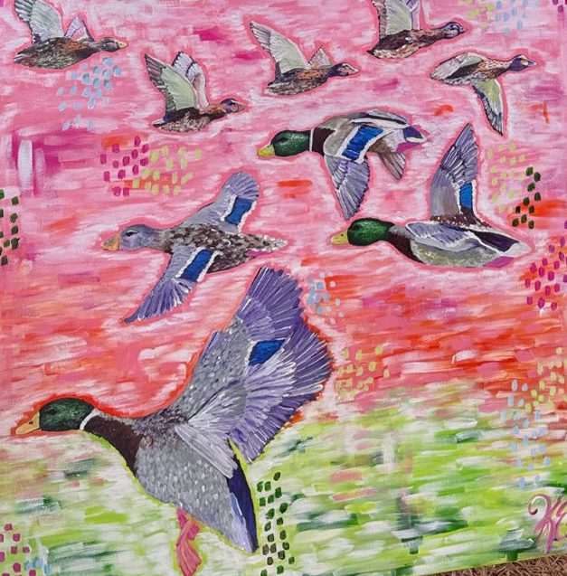 Painting of mallard ducks in flight over a pink sky