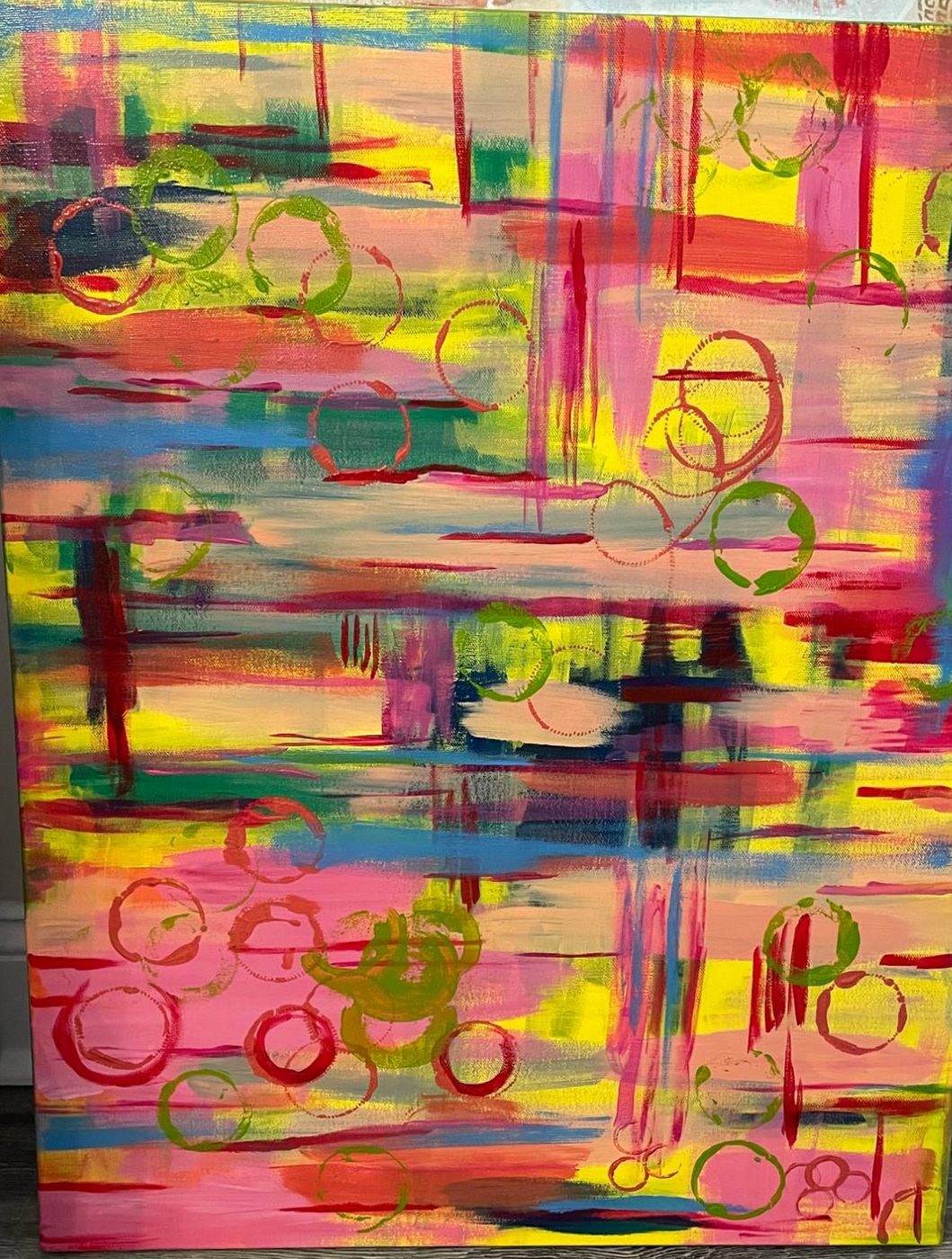 Abstract painting of pink, yellow and red brushstrokes with painted rings