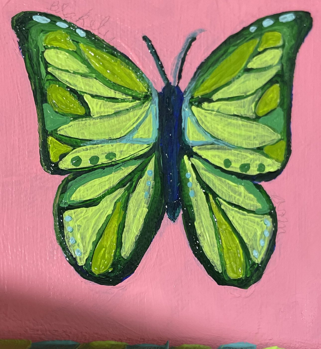 Small painting of a green butterfly on pink