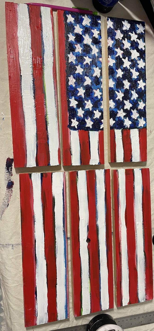 American flag painted across six wooden boards